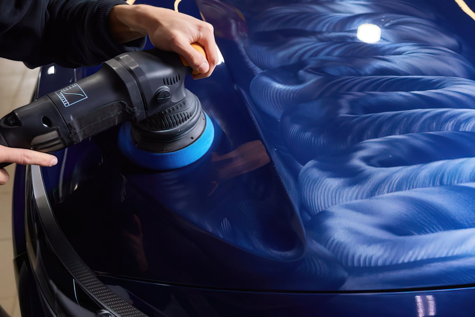 Machine polishing a bonnet close-up